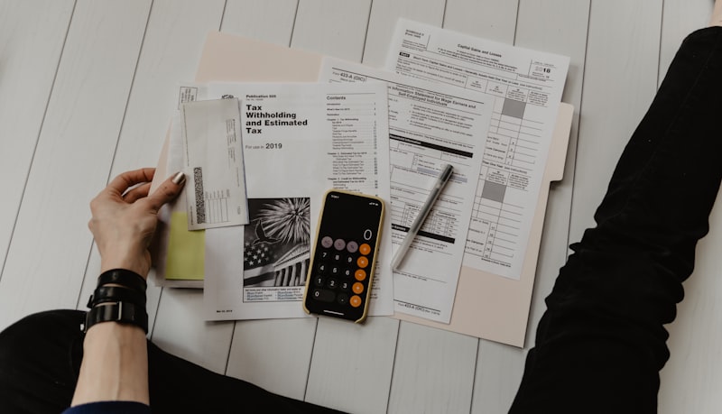 Budget planning with calculator and financial documents on desk